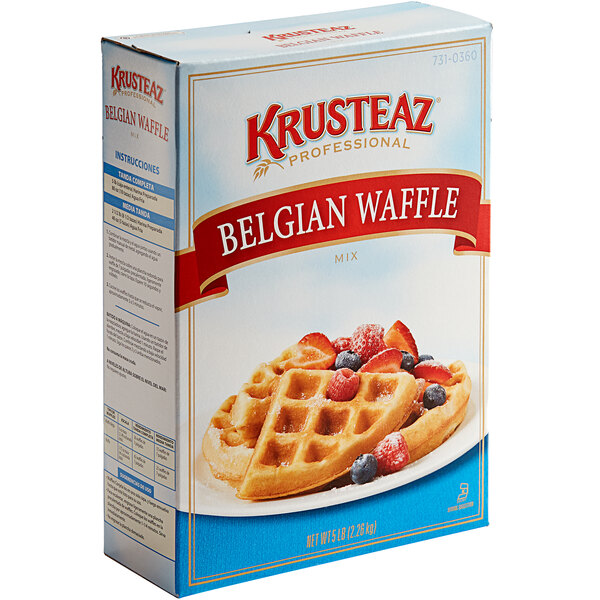 A box of Krusteaz Professional Belgian Waffle Mix with a waffle topped with berries.