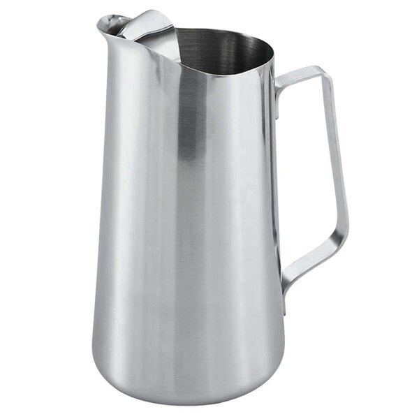 A Vollrath stainless steel water pitcher with a handle.