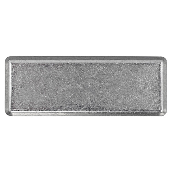 A rectangular metal plate with an antique finish.