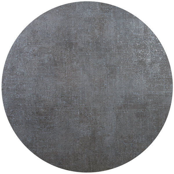 A BFM Seating Midtown round table top in frosted slate gray with white specks.