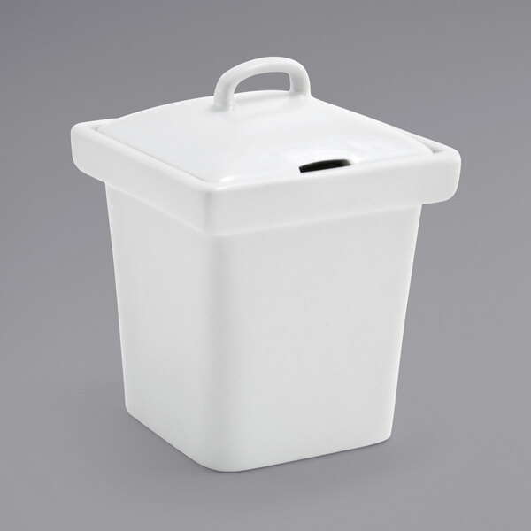 A white square porcelain pot with a notched lid.