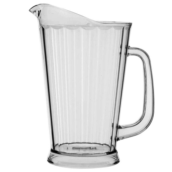 A clear plastic Vollrath beverage pitcher with a handle.