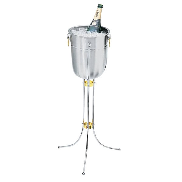 A champagne bottle in a stainless steel bucket on a metal stand.