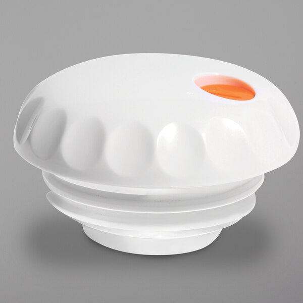 A white round Vollrath lid with an orange center.