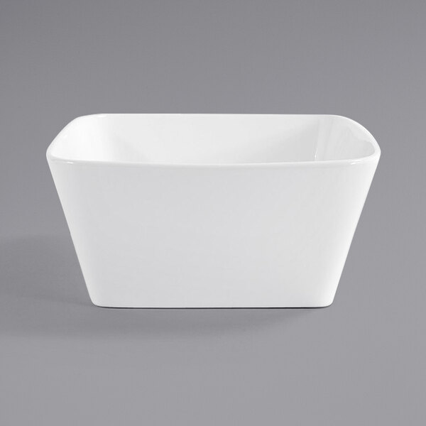 A close-up of a Front of the House bright white square porcelain bowl.