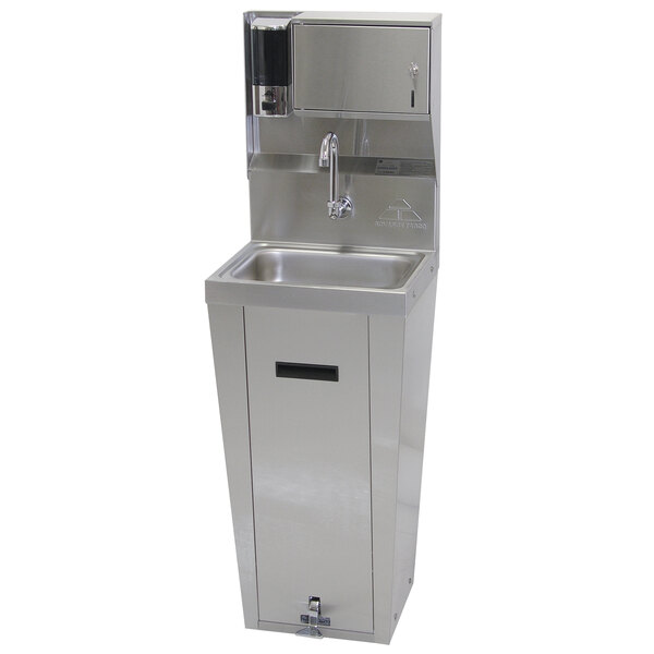 An Advance Tabco stainless steel hands-free hand sink with pedestal base and soap and towel dispenser.