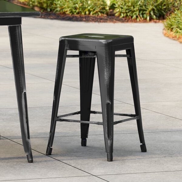 Lancaster Table & Seating Alloy Series Distressed Onyx Black Outdoor Backless Counter Height Stool
