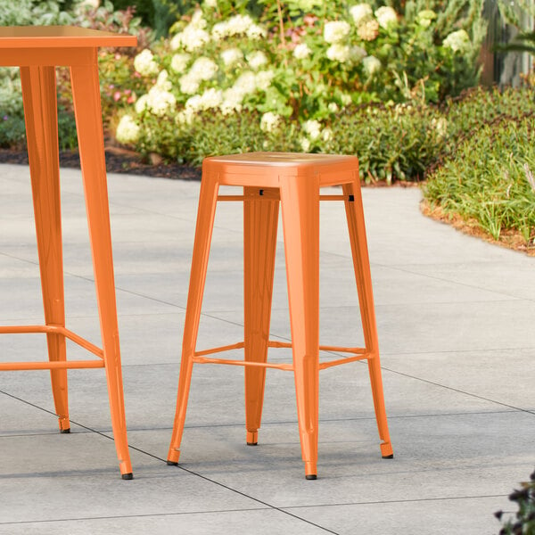 Lancaster Table & Seating Alloy Series Orange Outdoor Backless Barstool