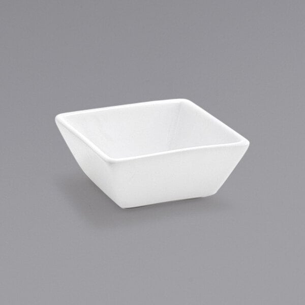 A Front of the House Kyoto white square porcelain sauce dish.