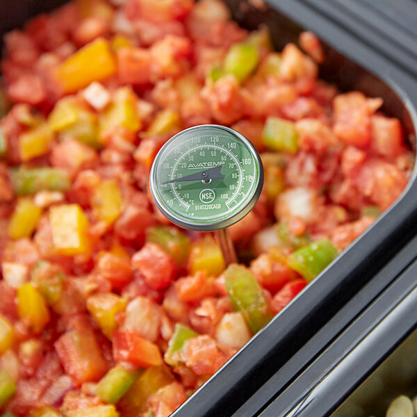 A AvaTemp pocket probe thermometer in a container of food.