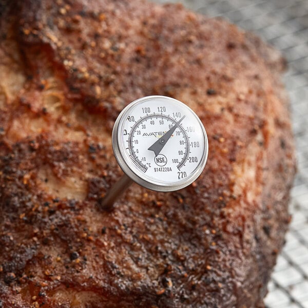 An AvaTemp pocket probe thermometer taking the temperature of a piece of meat.