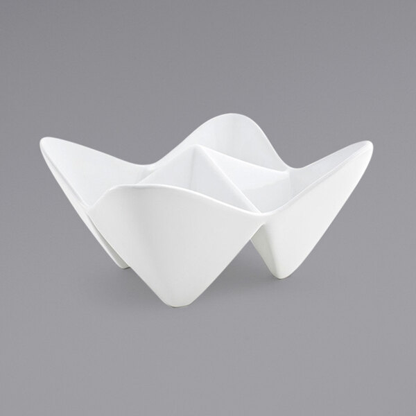 A white porcelain bowl with 4 triangular sections.
