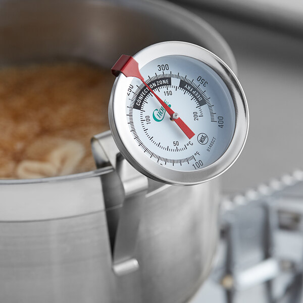 A Choice 6" Candy / Deep Fry Probe Thermometer in a pot of boiling water.