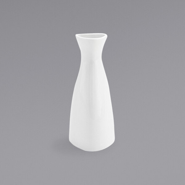 A white Front of the House Kyoto bud vase on a gray surface.