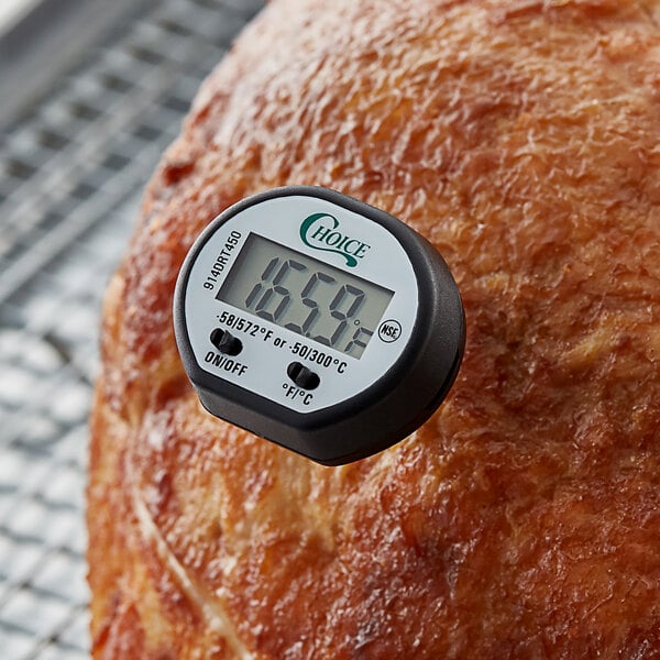 A Choice digital pocket probe thermometer inserted into meat.