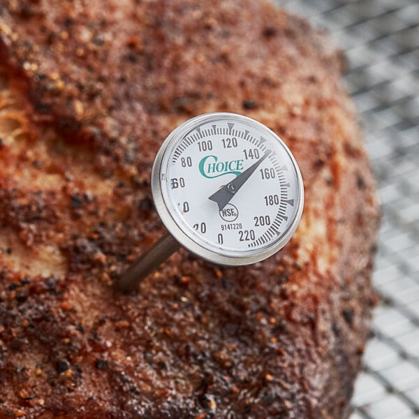 A Choice 5" pocket probe dial thermometer gauge inserted into a piece of meat.
