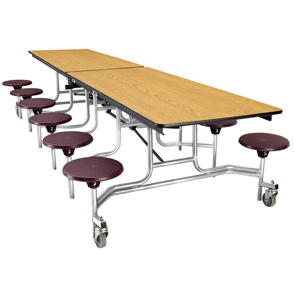 A National Public Seating mobile cafeteria table with stools on it.