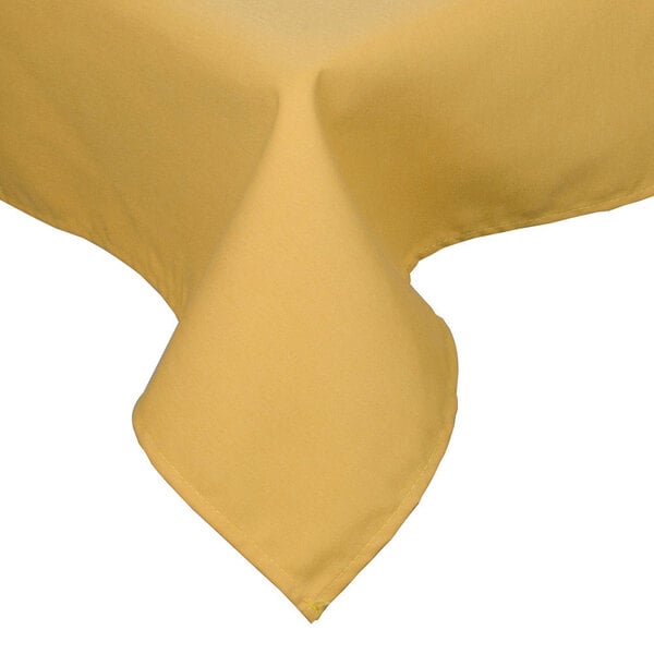A yellow rectangular poly/cotton blend tablecloth with a folded edge.
