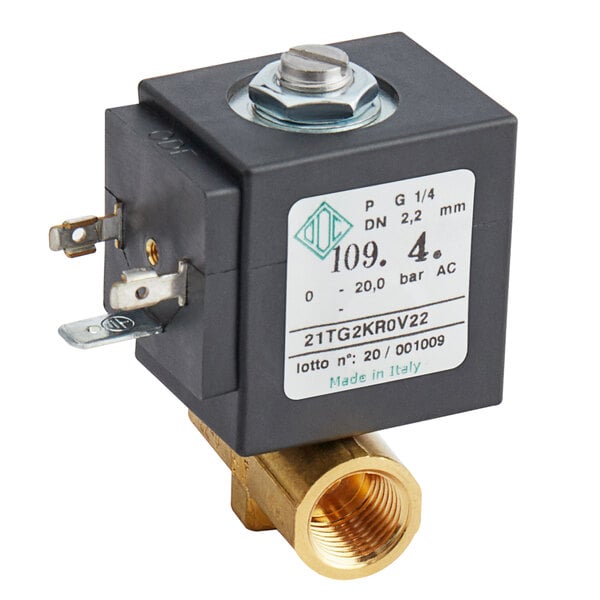 A brass Estella Caffe solenoid valve with a white label.