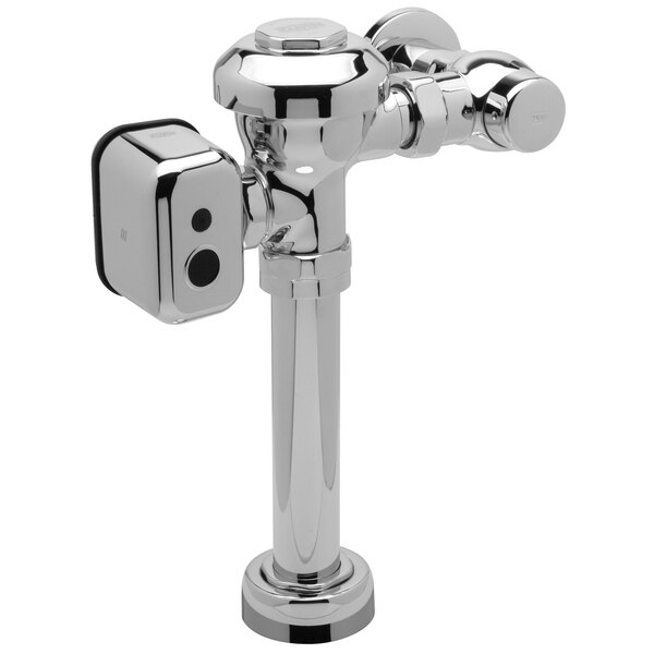 A Zurn chrome toilet flush valve with a metal pipe.