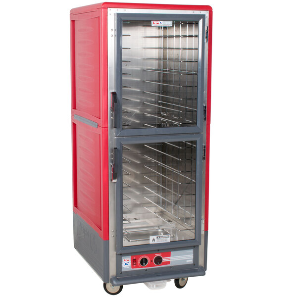 A red and grey Metro C5 heated holding cabinet with clear Dutch doors.