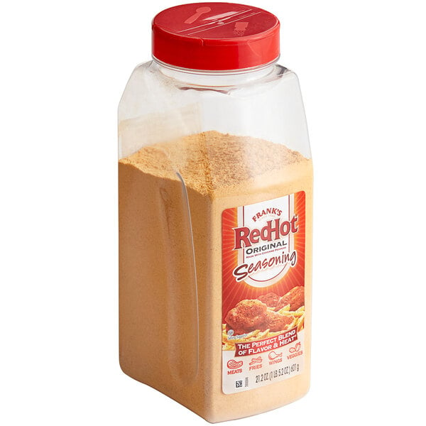 A plastic container of Frank's RedHot Original seasoning mix.