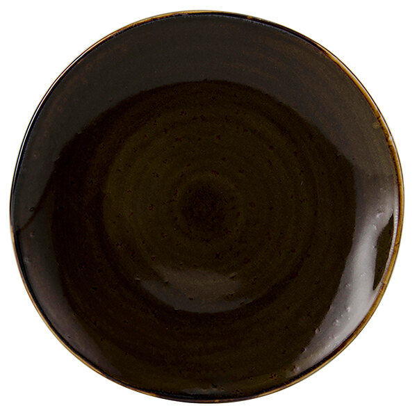 A white china plate with a brown spiral pattern and black circle in the center.