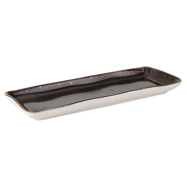 A rectangular Tuxton china tray with a black and white geode design.
