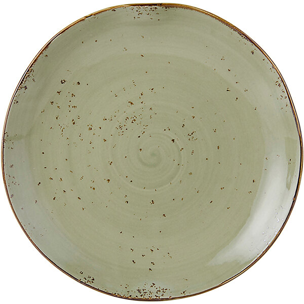A white Tuxton china plate with a green and brown swirl pattern.