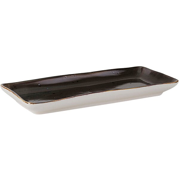 A rectangular Tuxton china tray with a black and white geode design.
