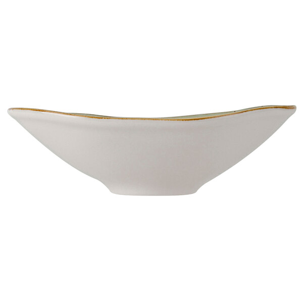 A white Tuxton china bowl with gold trim.