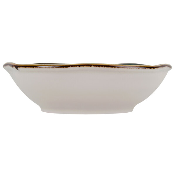 A white Tuxton china bowl with a brown rim.