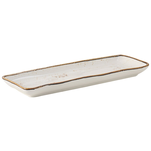 A rectangular white china tray with brown edges.