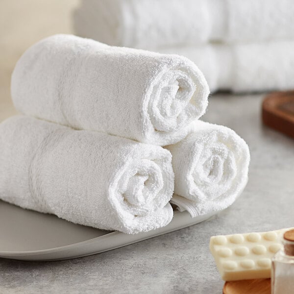A stack of white Lavex Premium hand towels.