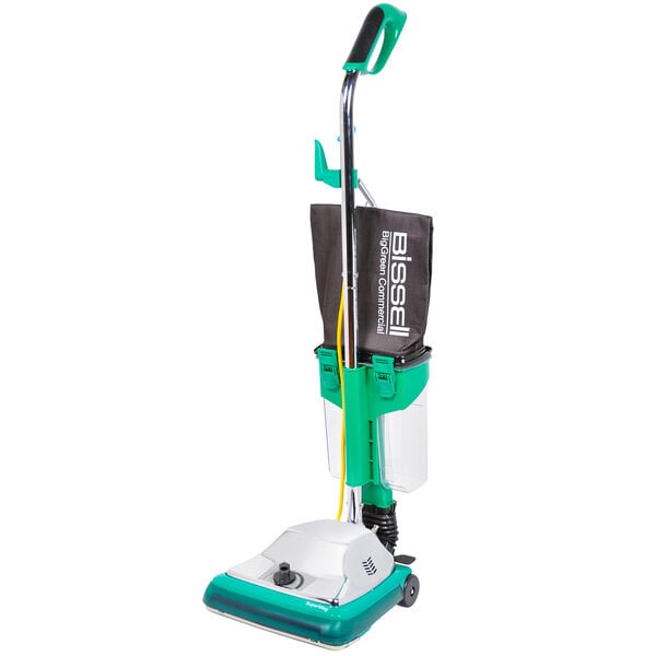 A green and white Bissell Commercial ProCup upright vacuum cleaner with a green bag and handle.