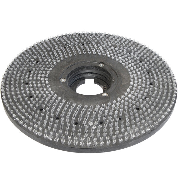 A Bissell Commercial 19" Pad Driver, a circular metal object with holes in it.