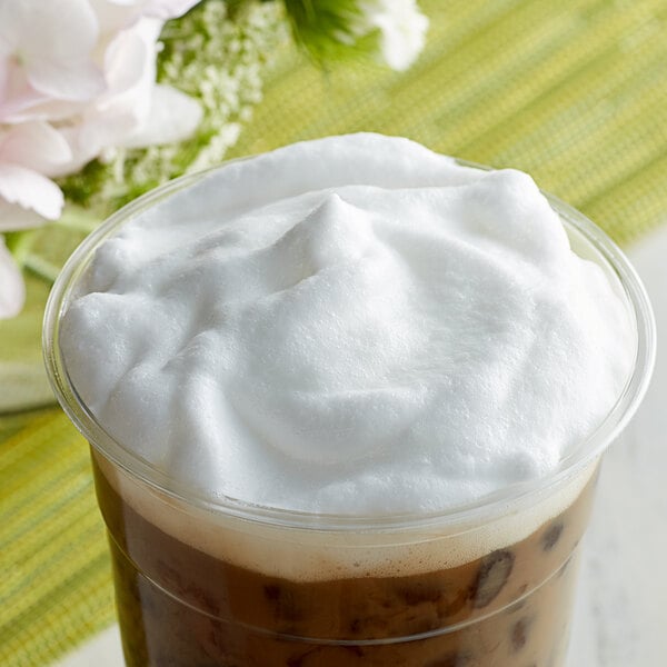 A cup of coffee with foam made with Bossen Crema Whipping Powder.