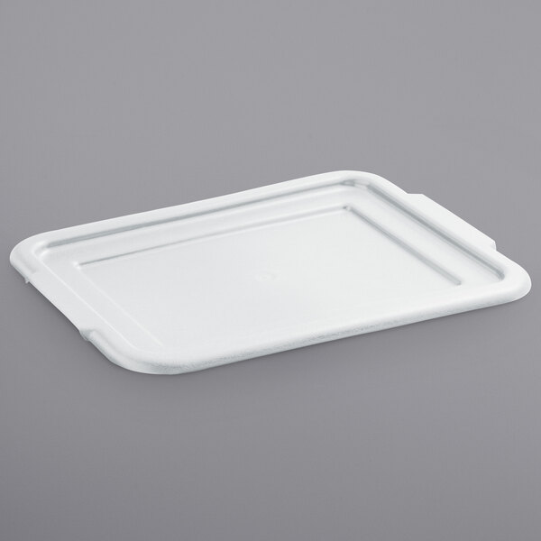A white tray lid for a Vollrath bus tub on a gray surface.