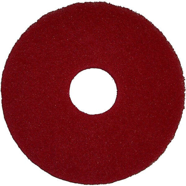 A red circular Bissell floor polishing pad with a hole in the center.