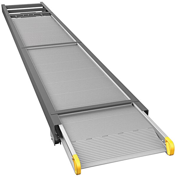 A metal ramp with yellow handles.