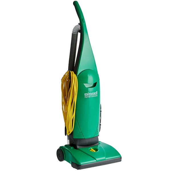 A green Bissell Commercial ProBag upright vacuum cleaner with a yellow cord.