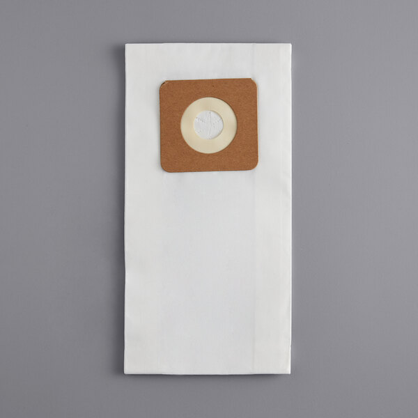 A white paper bag with a brown circle and a hole in it.