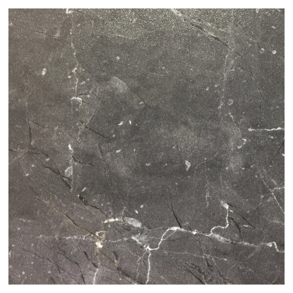 A Grosfillex gray marble table top with scratches.