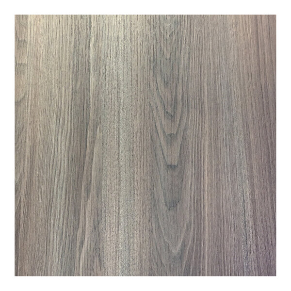 A wood grained surface of a Grosfillex walnut table top.