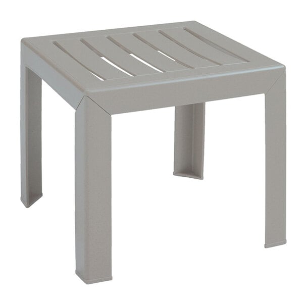 A Grosfillex Westport barn gray plastic low table with legs and a slatted top.