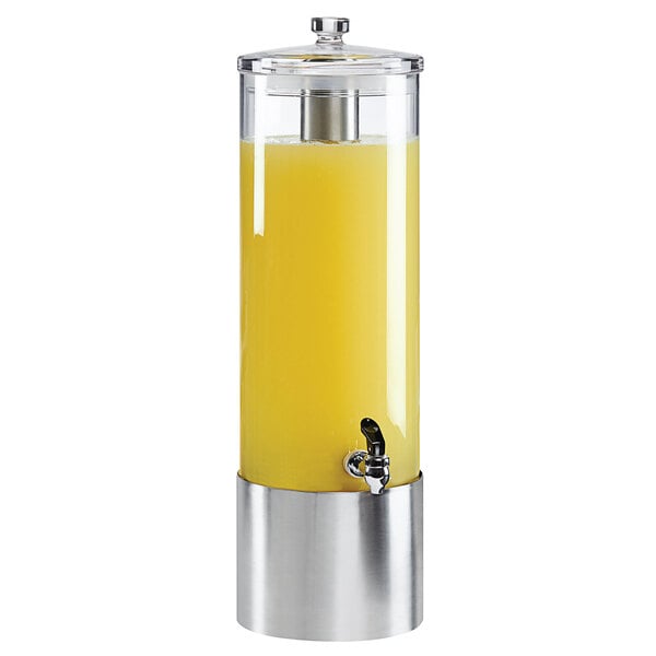 A Cal-Mil round plastic beverage dispenser with a yellow liquid in it.