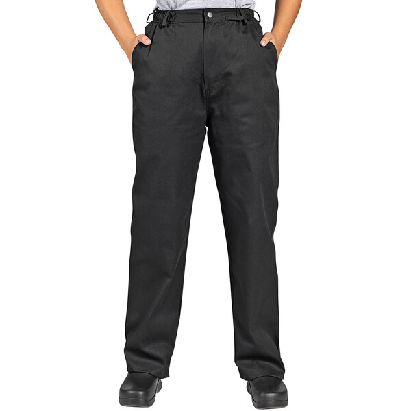 A man wearing Uncommon Chef black executive chef pants.