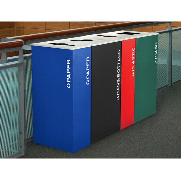 A row of rectangular Ex-Cell Kaiser rectangular paper recycling receptacles in royal blue, red, and yellow.