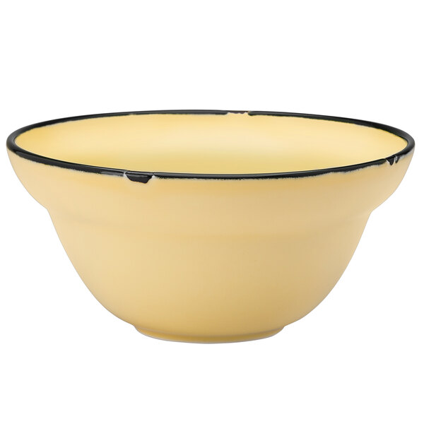 A yellow Luzerne Tin Tin soup bowl with a black rim.