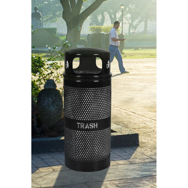 An Ex-Cell Kaiser black round trash can with a dome lid.